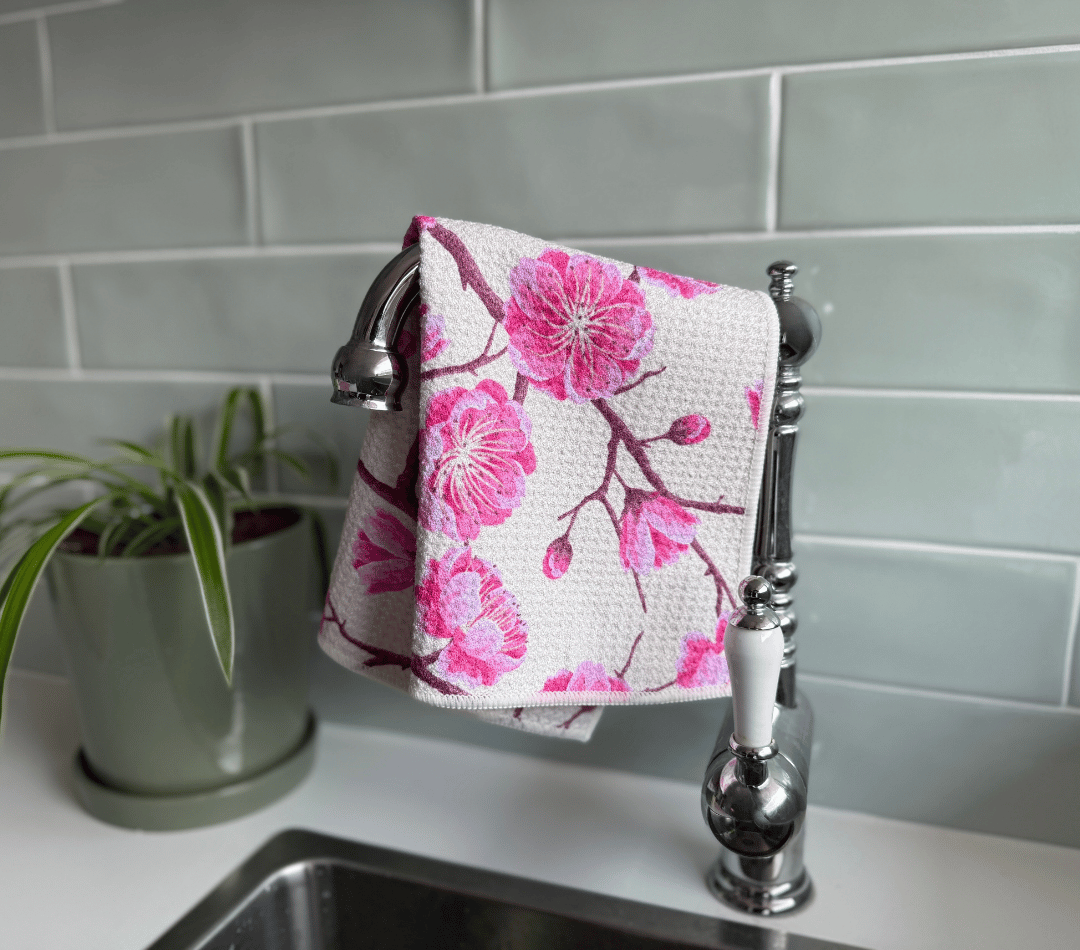 DirtyGirl Blossom Bloom Cloth draped over sink tap – Absorbent weave for spills