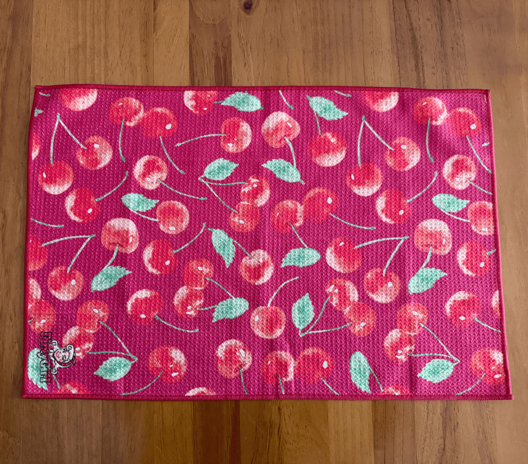 Flatlay of DirtyGirl Cherry Crush Cloth laid flat on benchtop – Quick-drying fabric