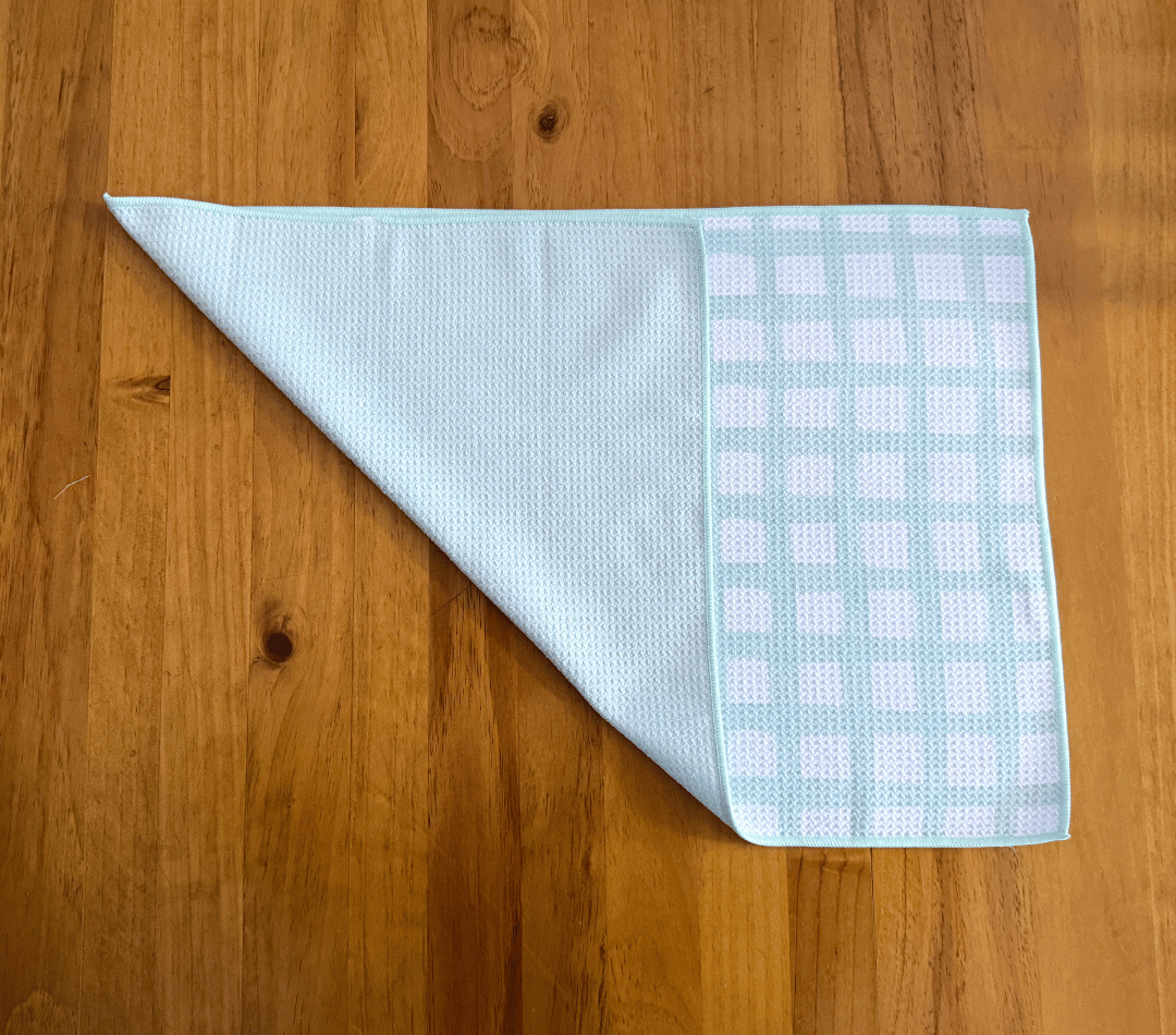 Folded DirtyGirl Classic Mint Cloth displayed on bench – Reusable and eco-friendly