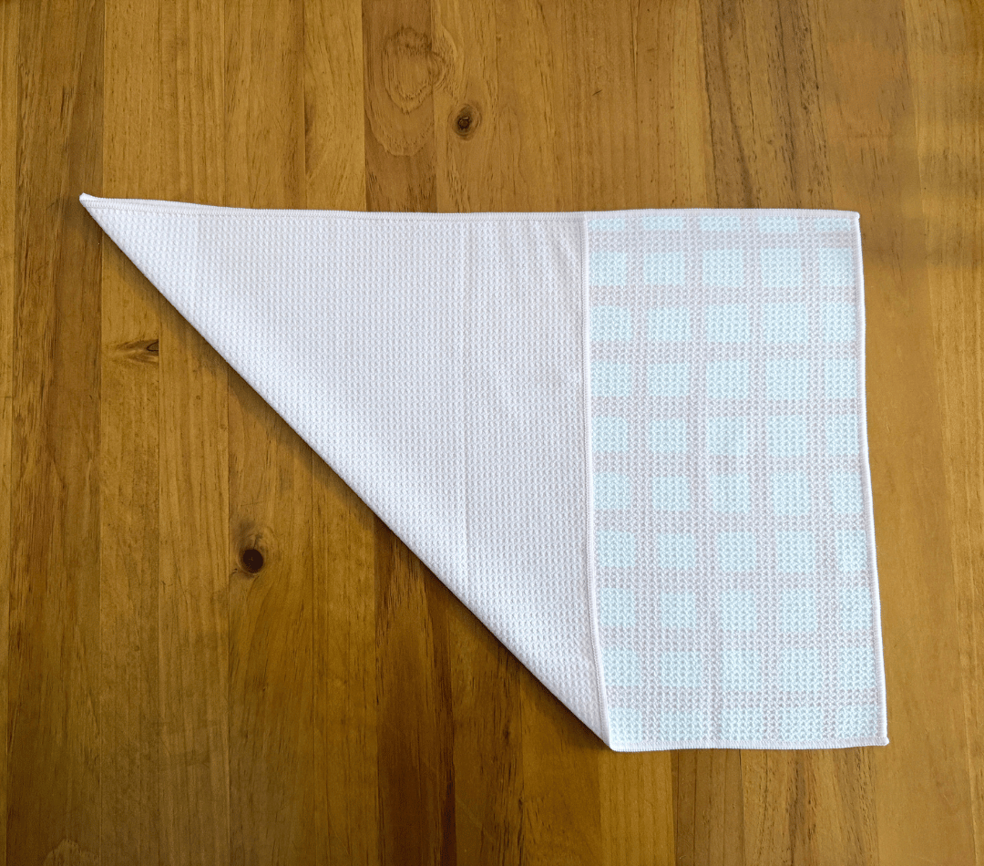 Folded DirtyGirl Classic Pink Cloth displayed on bench – Reusable and eco-friendly