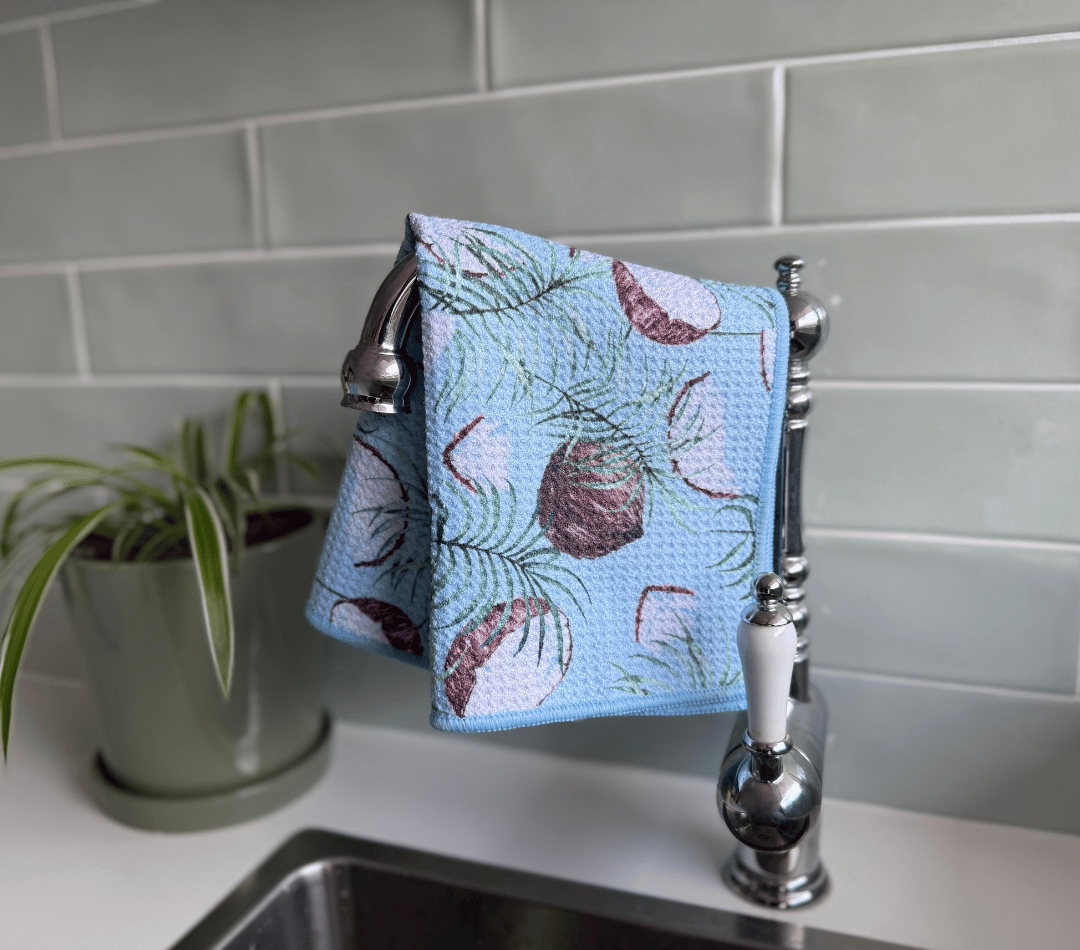 DirtyGirl Coconut Glow Cloth draped over sink tap – Absorbent weave for spills