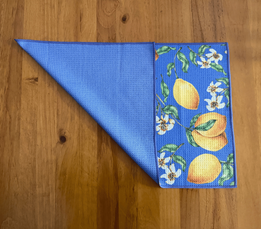 Folded DirtyGirl Lemon Burst Cloth displayed on bench – Reusable and eco-friendly