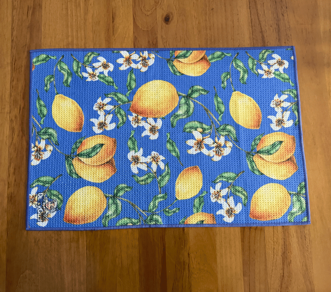 Flatlay of DirtyGirl Lemon Burst Cloth laid flat on benchtop – Quick-drying fabric