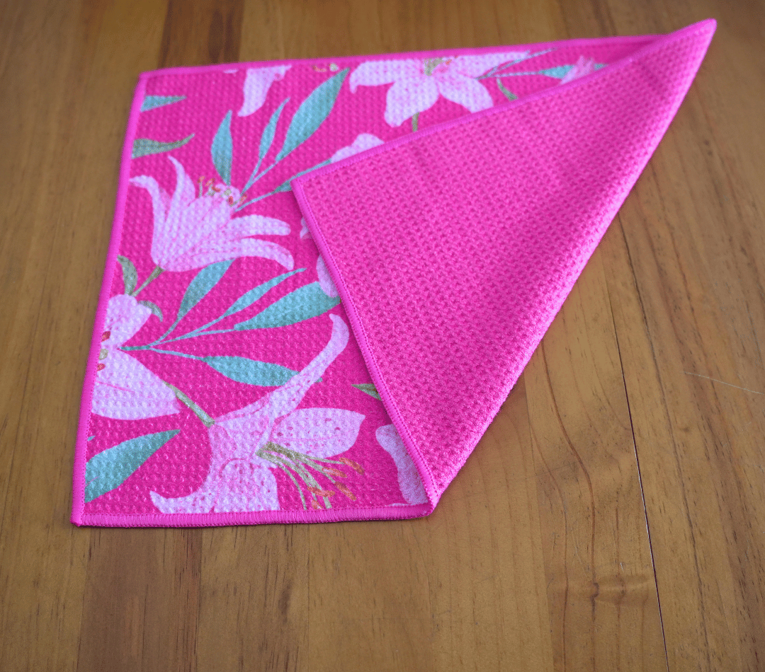Folded DirtyGirl Lily Blush Cloth displayed on bench – Reusable and eco-friendly