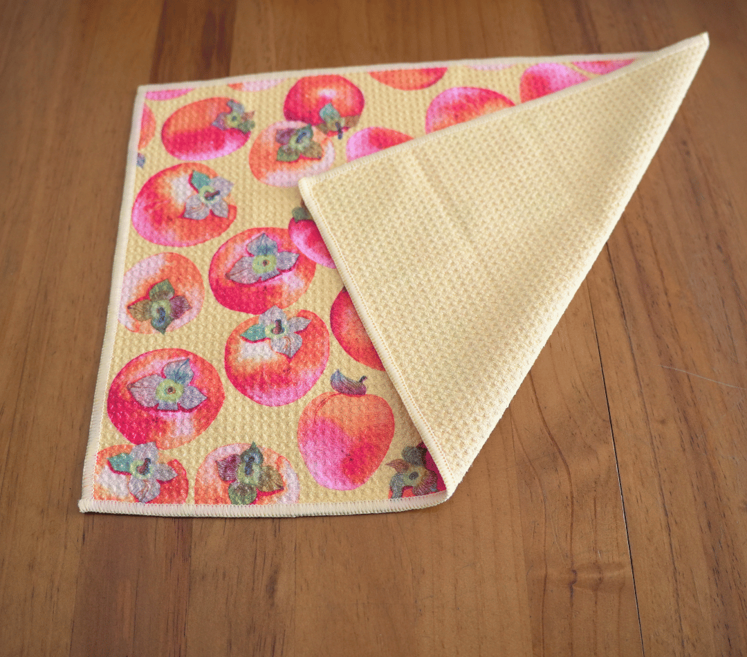 Folded DirtyGirl Persimmon Polish Cloth displayed on bench – Reusable and eco-friendly