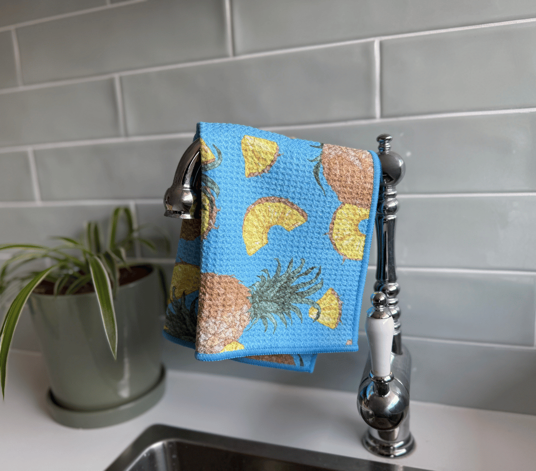 DirtyGirl Pineapple Express Cloth draped over sink tap – Absorbent weave for spills