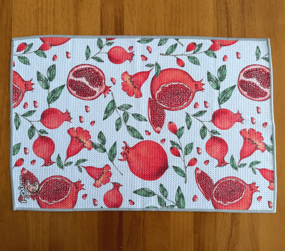 Flatlay of DirtyGirl Pomegranate Pop Cloth laid flat on benchtop – Quick-drying fabric