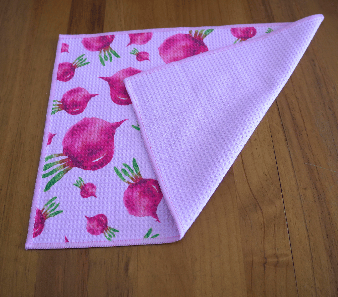 Folded DirtyGirl Radish Remedy Cloth displayed on bench – Reusable and eco-friendly